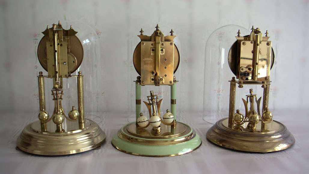 Three German torsion pendulum clocks